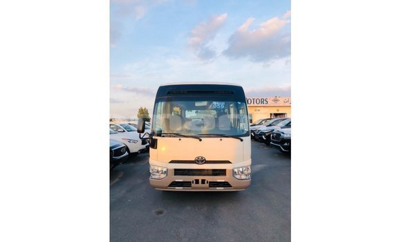 Buy Import Toyota Coaster White Car in Import - Dubai in Dhufar