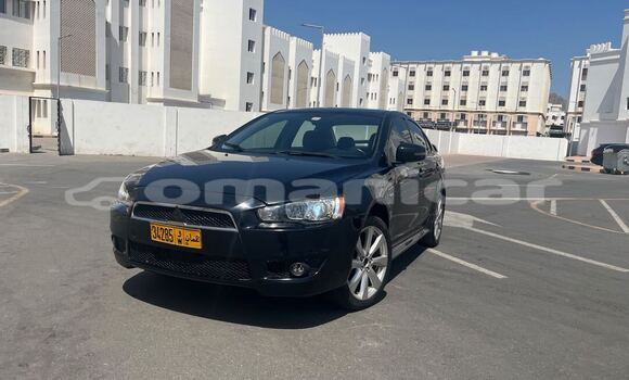 Buy Used Mitsubishi Lancer Black Car in Wadi Al Kabir in Masqat